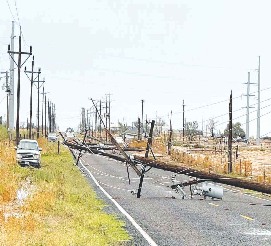A downed power line blocks South County Road 1150 following heavy thunderstorms Thursday that brought flooding and storm damage to Greenwood. The Greenwood Volunteer Fire Department responded to multiple reports of downed power lines and trees during the storm.