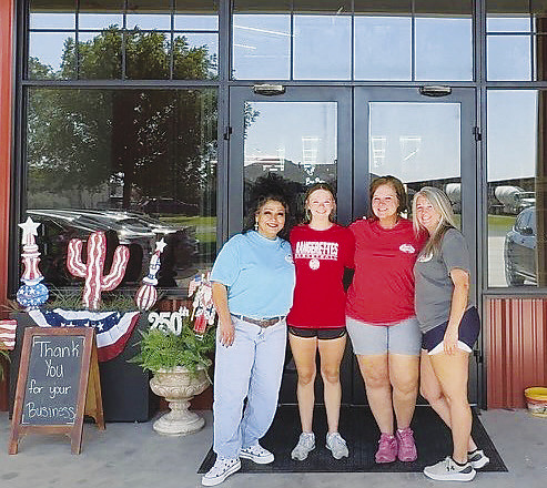From left, Cori Pena, known as the store’s “bow queen,” Briley Gardenhire, Michelle Lloyd and Ashley Byram stand in front of Michelle’s Adoorable Creations in Greenwood. The business, located at 2800 S. County Road 1067, recently expanded its storefront and now carries homecoming supplies for customers across west Texas.