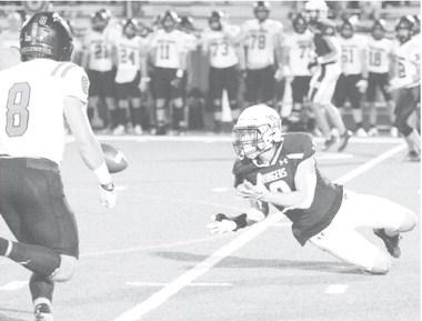 Greenwood receiver Tyezen Smith attempts to make a sliding catch during last week’s game against Shallowater.