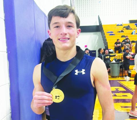 Regional champion Hunter Outlaw proudly shows off his gold medal.