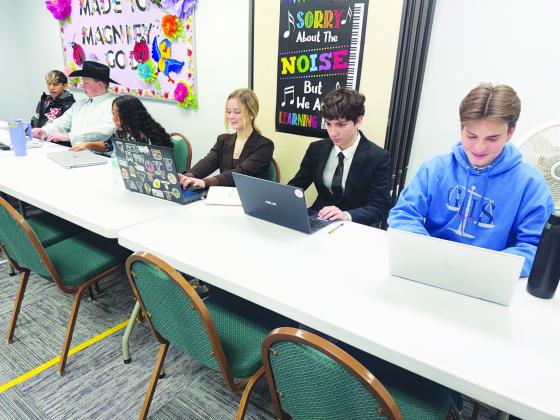Members of the Greenwood High School debate team prepare during a recent competition in Monahans.