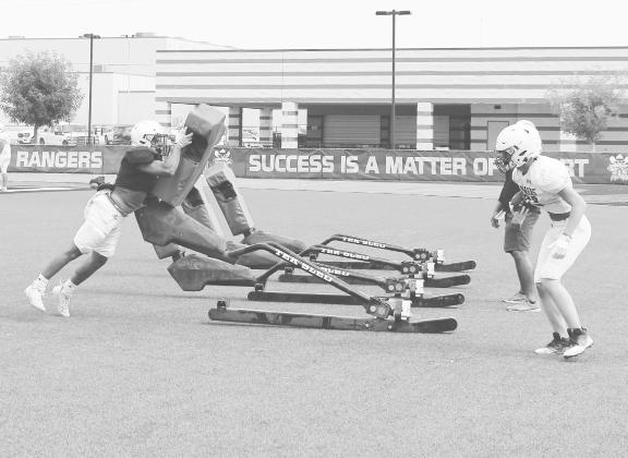 The Greenwood Ranger’s defense works on shedding blockers and getting to the ball carrier. The Rangers will get their first live action against an opponent this Friday when they host Big Spring at 6 p.m. in the first scrimmage of the season.