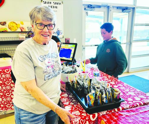 Sandra Smith smiles behind the counter at the middle school cafeteria’s Snack Shack, where she continues to serve students each day. She has worked in GISD cafeterias for 38 years, known for her steady presence and love for the kids.