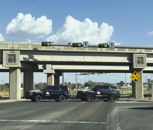 DPS units block the intersection of Loop 250 and the eastbound Interstate 20 service road following a deadly crash Sept. 10.