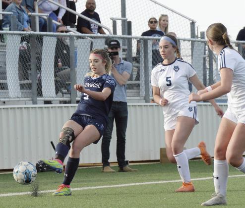 ABOVE: District MVP Brooke Clifton advances the ball during the area playoff victory over Amarillo West Plains. BELOW: District Newcomer of the Year Ella Cook