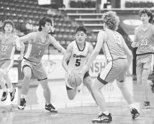 Greenwood point guard Shawn Kelly (5) drives the lane during Bi-District action in Wolforth.