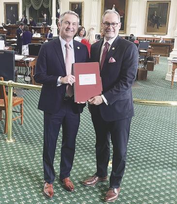Caption: State Sen. Kevin Sparks, R-District 31 (left), and state Rep. Tom Oliverson, R-Cypress, stand in the Texas Senate chamber this week following the passage of the DOCTOR Act.