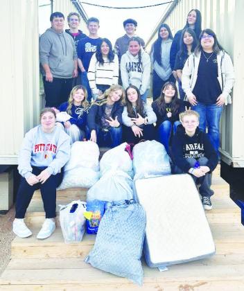 Greenwood High School FFA students pose after collecting towels, blankets, sheets and dog bedding ahead of the winter storm to support Fix West Texas in their efforts to keep stray dogs warm. The nonprofit organization runs a foster and adoption programs for strays and provides low-cost spay and neuter services for any pet owner in West Texas.