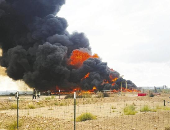The Greenwood Volunteer Fire Department responded to a heater treater explosion at an oilfield site on County Road 1130 on Wednesday, May 27 (above). One week earlier, Greenwood crews also assisted with a tank battery fire on FM 1788 (below) that burned for about six hours after reportedly being sparked by a lightning strike.