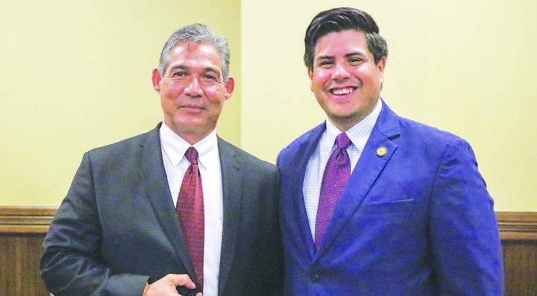 Jay Marquez, left, stands with Midland County Commissioner Steven Villela during Marquez’s swearing-in ceremony Tuesday.