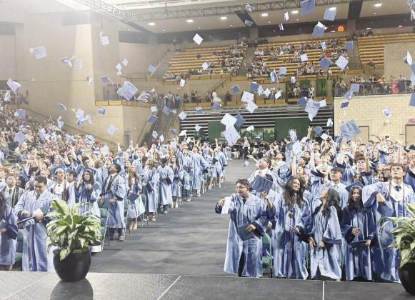 Greenwood High School graduates celebrate the end of one chapter and the start of another as caps fly through the air following commencement ceremonies at the Midland College Chaparral Center on Thursday, May 21.
