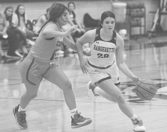 Greenwood guard Brinkley Smith drives around an Abilene Cooper defender during non-district action earlier this season.