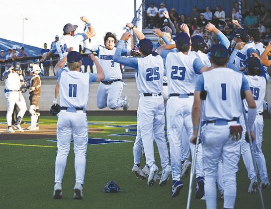 Joaquin Tavarez (3) celebrates with his teammates after blasting a home run. by Sam Cravey