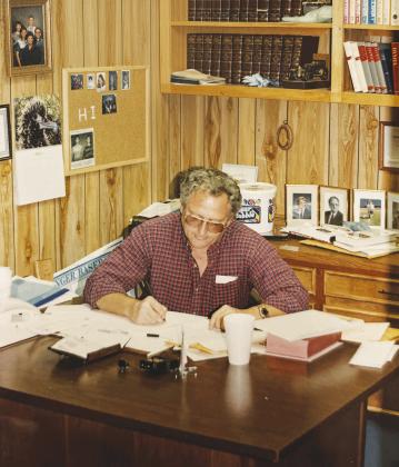 Pastor Waymon Swopes works at his desk during his years as senior pastor of Greenwood Baptist Church. He served as pastor from 1987 until his retirement in 2010.