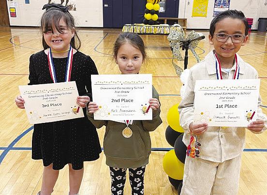 Second-grade spelling bee winners, from right, champion Domenik Granados, second-place finisher Ka'li Armendariz and third-place finisher Aurora Ramos-Verdugo.