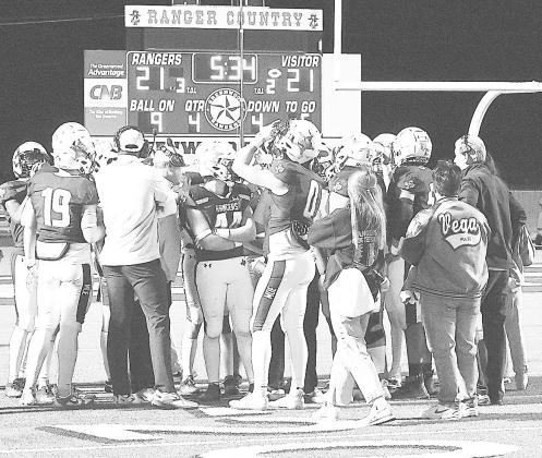 Greenwood’s defensive huddle during a timeout. Hirschi was knocking on the end zone door on fourth down in the fourth quarter looking to go ahead. Ranger Kason Brooks broke up the pass in the end zone to keep the game tied allowing Greenwood to eventually win the game 29-28. by Sam Cravey