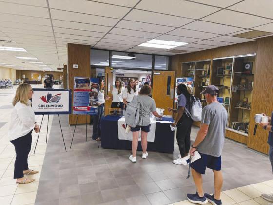 The Greenwood Education Foundation offered “Back-2-School Blessings” this week for GISD teachers returning to prepare for the first day of school Monday, Aug. 10. Greenwood High School teachers picked up small gifts on their way into the library, where the foundation provided breakfast.