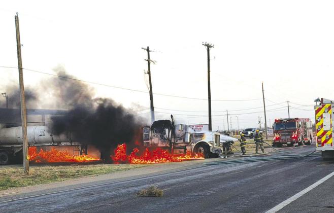 Firefighters battle flames from a burning semi-truck pulling a tanker trailer on FM 1379 near East County Road 120 on Tuesday, March 10. The Greenwood Volunteer Fire Department and Midland Fire Department responded. No injuries were reported.