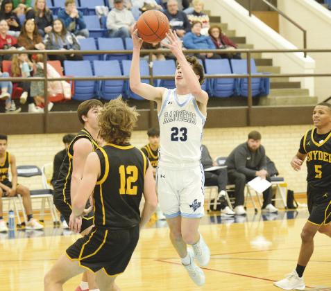 Greenwood guard Landen Stewart flies through the air looking for two points in non-district action against Snyder earlier this season.