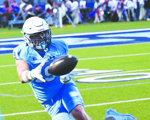 Beckham Whiteside makes a sliding catch along the sideline setting Greenwood up for another touchdown right before the halftime against Andrews last Friday.