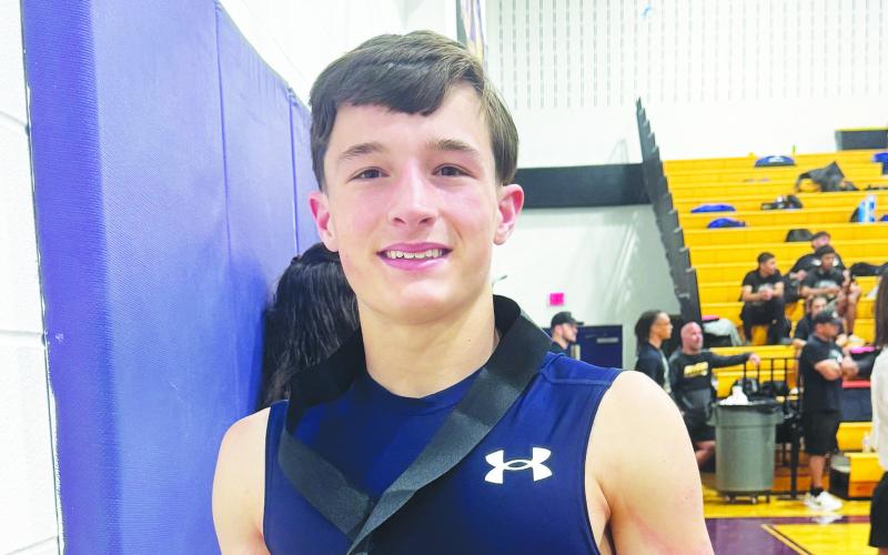 Regional champion Hunter Outlaw proudly shows off his gold medal.