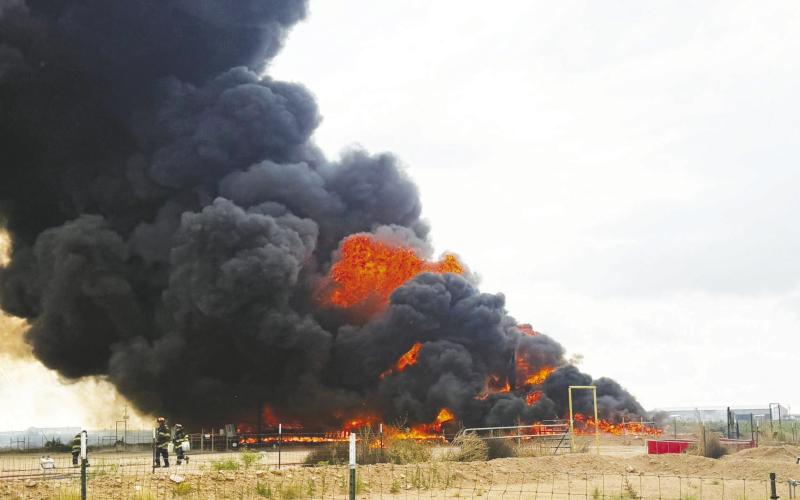 The Greenwood Volunteer Fire Department responded to a heater treater explosion at an oilfield site on County Road 1130 on Wednesday, May 27 (above). One week earlier, Greenwood crews also assisted with a tank battery fire on FM 1788 (below) that burned for about six hours after reportedly being sparked by a lightning strike.