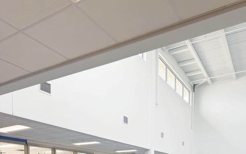 Two construction workers inside one of Greenwood ISD’s new campuses as crews continue preparing the buildings for the start of the 2026-27 school year in August.