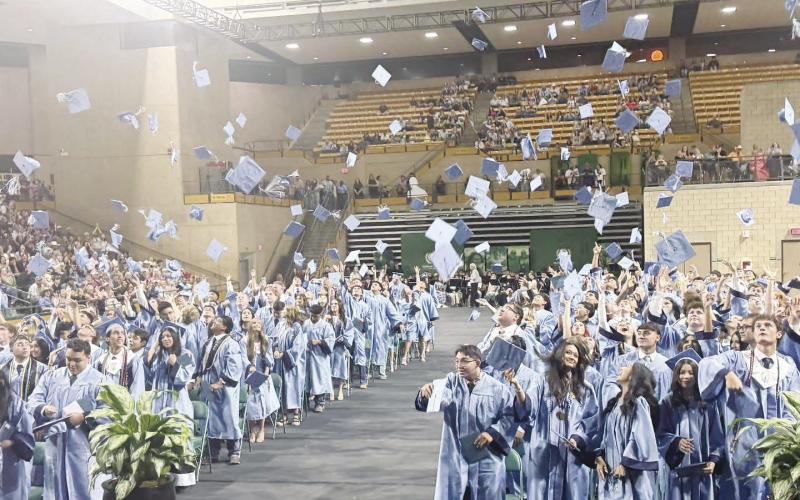 Greenwood High School graduates celebrate the end of one chapter and the start of another as caps fly through the air following commencement ceremonies at the Midland College Chaparral Center on Thursday, May 21.