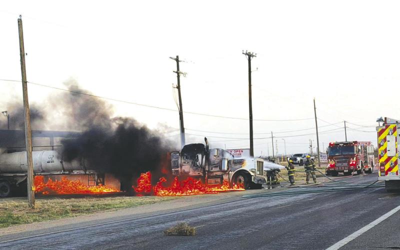 Firefighters battle flames from a burning semi-truck pulling a tanker trailer on FM 1379 near East County Road 120 on Tuesday, March 10. The Greenwood Volunteer Fire Department and Midland Fire Department responded. No injuries were reported.