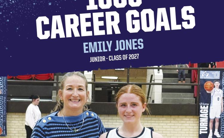 Emily Jones and her coach Aimee Kilgore celebrate her 1000th Career basketball goal.