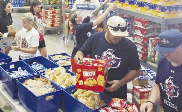 Outlaws donate equipment to middle school athletics, strengthening community ties