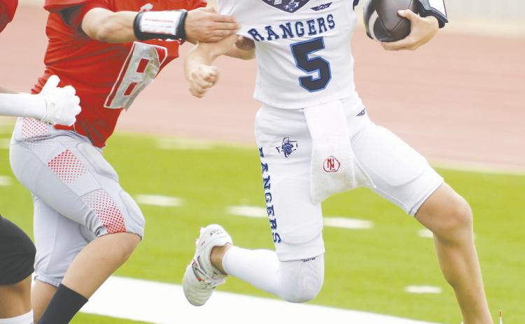 Brock Hughes scores a Greenwood touchdown.