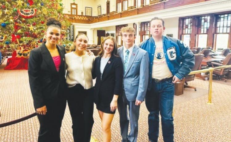 Greenwood High School debate students pictured inside the Texas State Capitol