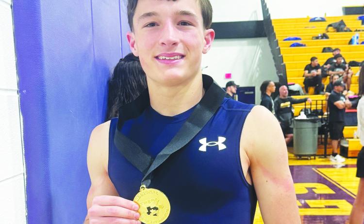 Regional champion Hunter Outlaw proudly shows off his gold medal.
