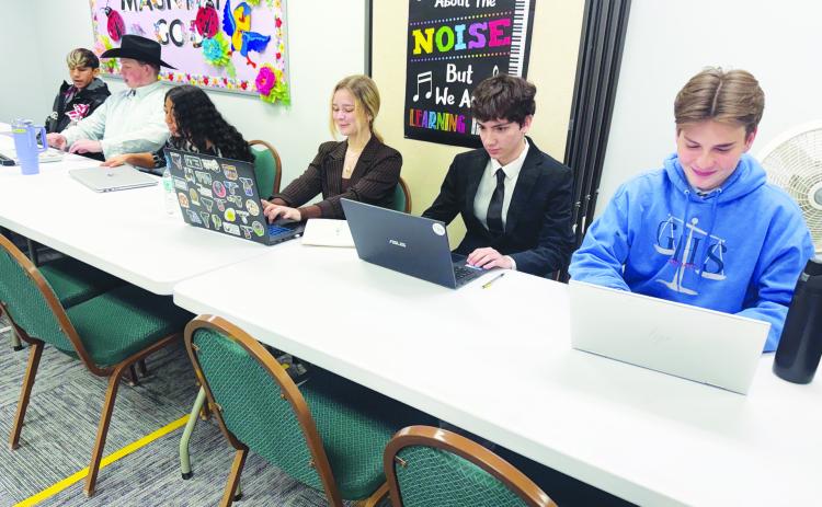 Members of the Greenwood High School debate team prepare during a recent competition in Monahans.