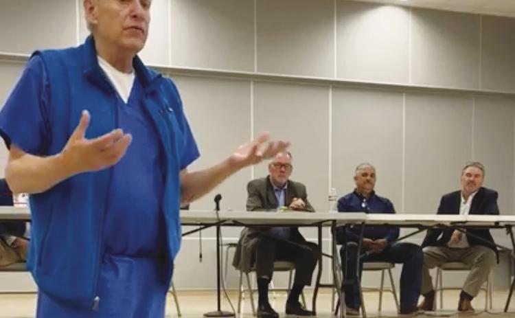 MCUD President Dr. Shelton Viney talks to Greenwood residents during a town hall meeting on Tuesday about the proposed bond for a district wide water system.