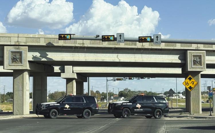 DPS units block the intersection of Loop 250 and the eastbound Interstate 20 service road following a deadly crash Sept. 10.