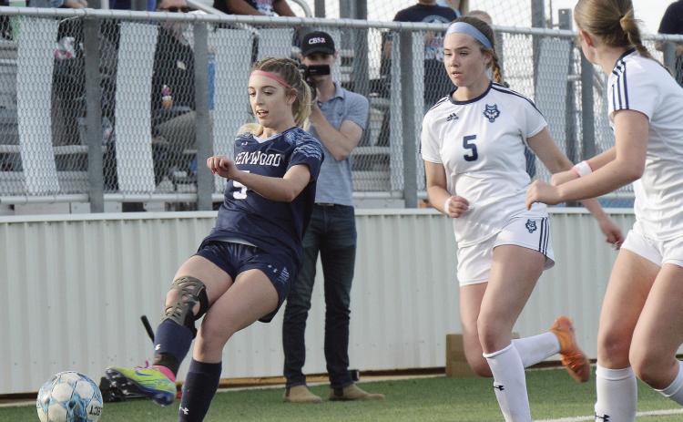 ABOVE: District MVP Brooke Clifton advances the ball during the area playoff victory over Amarillo West Plains. BELOW: District Newcomer of the Year Ella Cook