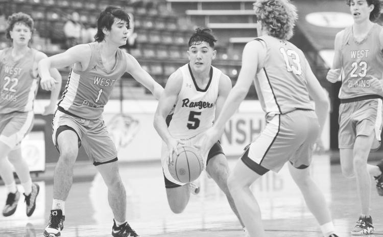 Greenwood point guard Shawn Kelly (5) drives the lane during Bi-District action in Wolforth.