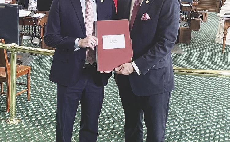 Caption: State Sen. Kevin Sparks, R-District 31 (left), and state Rep. Tom Oliverson, R-Cypress, stand in the Texas Senate chamber this week following the passage of the DOCTOR Act.