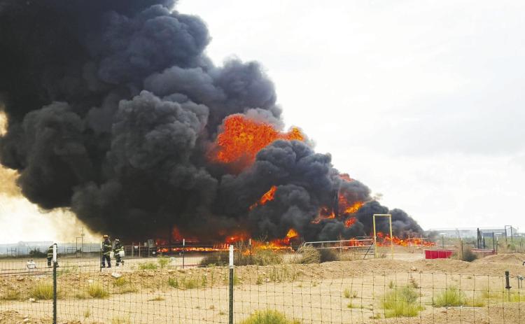 The Greenwood Volunteer Fire Department responded to a heater treater explosion at an oilfield site on County Road 1130 on Wednesday, May 27 (above). One week earlier, Greenwood crews also assisted with a tank battery fire on FM 1788 (below) that burned for about six hours after reportedly being sparked by a lightning strike.