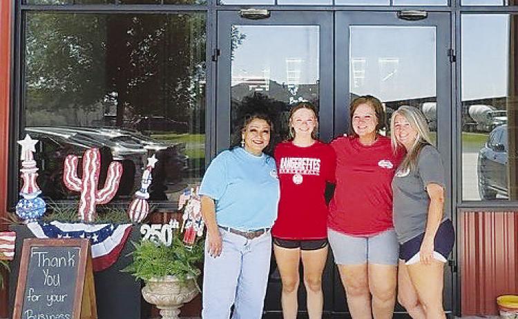 From left, Cori Pena, known as the store’s “bow queen,” Briley Gardenhire, Michelle Lloyd and Ashley Byram stand in front of Michelle’s Adoorable Creations in Greenwood. The business, located at 2800 S. County Road 1067, recently expanded its storefront and now carries homecoming supplies for customers across west Texas.