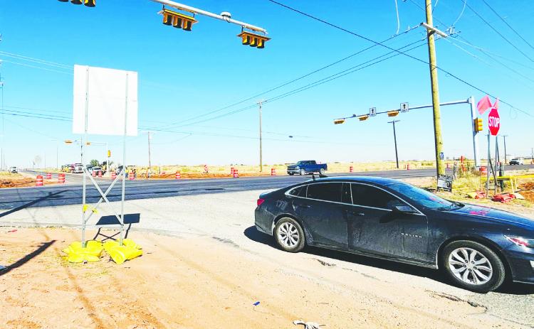 The intersection at FM 307 and CR 1110, where a long-awaited traffic light remains inactive.