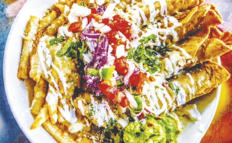 Crispy chicken flautas topped with tomato consommé and Oaxaca cheese were served as a special this week at Chill N Vibe in Greenwood, located in the former Ranger Station building on FM 307.