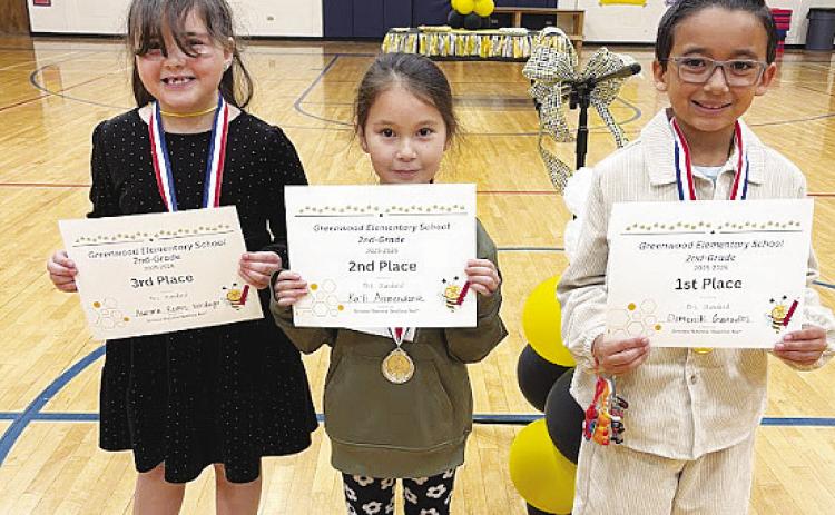 Second-grade spelling bee winners, from right, champion Domenik Granados, second-place finisher Ka'li Armendariz and third-place finisher Aurora Ramos-Verdugo.