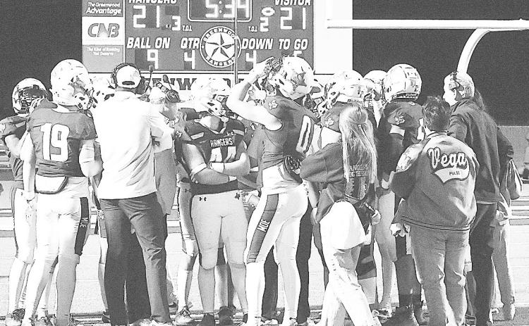 Greenwood’s defensive huddle during a timeout. Hirschi was knocking on the end zone door on fourth down in the fourth quarter looking to go ahead. Ranger Kason Brooks broke up the pass in the end zone to keep the game tied allowing Greenwood to eventually win the game 29-28. by Sam Cravey