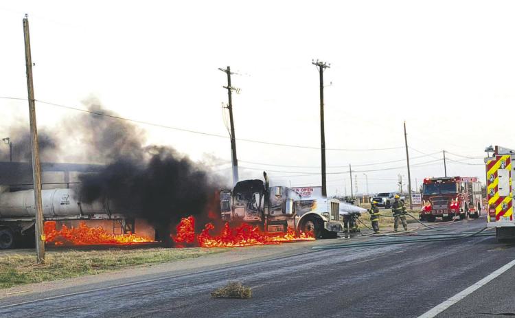 Firefighters battle flames from a burning semi-truck pulling a tanker trailer on FM 1379 near East County Road 120 on Tuesday, March 10. The Greenwood Volunteer Fire Department and Midland Fire Department responded. No injuries were reported.