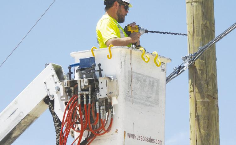 Electrical crews spent the better part of Tuesday afternoon fixing downed powerlines after a tanker truck took down several poles. See story this page.