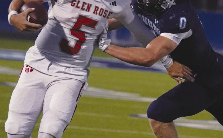 Greenwood senior Reece Watzl delivers a hard shove to force the Glen Rose quarterback out of bounds during Friday night’s matchup. photo by Graycee Underhill
