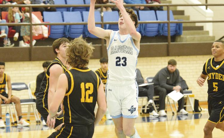 Greenwood guard Landen Stewart flies through the air looking for two points in non-district action against Snyder earlier this season.